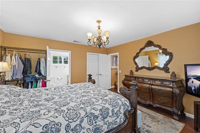 16900 Mayall St, North Hills, CA 91343 - bedroom with a chandelier, baseboards, and wood finished floors