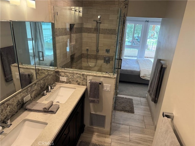 30724 Calle Resplendor, San Juan Capistrano, CA 92675 - ensuite bathroom with a shower stall, double vanity, baseboards, and wood finished floors