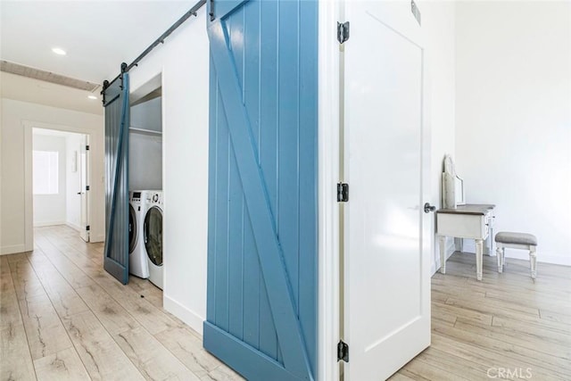 11911 Magnolia Blvd Unit 19, Valley Village, CA 91607 - laundry area featuring a barn door, light wood-style floors, washer and clothes dryer, baseboards, and recessed lighting