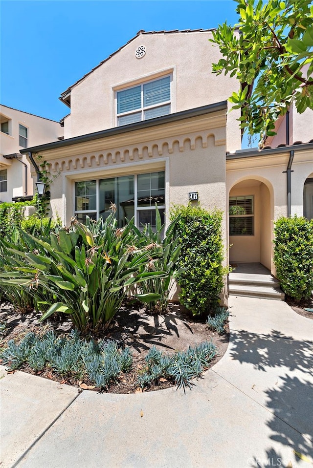 107 Tubeflower, Irvine, CA 92618 - view of front of property featuring stucco siding