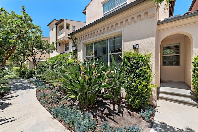 107 Tubeflower, Irvine, CA 92618 - doorway to property featuring stucco siding