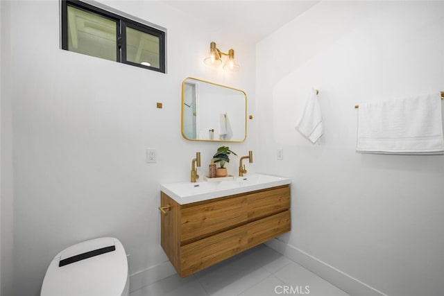 3209 Lakeknoll Dr, Fullerton, CA 92835 - bathroom with toilet, double vanity, baseboards, and tile patterned floors