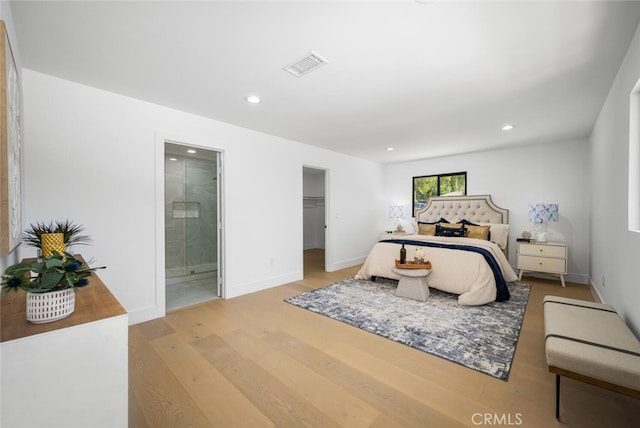 3209 Lakeknoll Dr, Fullerton, CA 92835 - bedroom featuring wood finished floors, connected bathroom, recessed lighting, baseboards, and a walk in closet