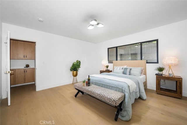 3209 Lakeknoll Dr, Fullerton, CA 92835 - bedroom with light wood-style flooring and baseboards