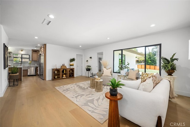 3209 Lakeknoll Dr, Fullerton, CA 92835 - living area with recessed lighting, light wood finished floors, and baseboards