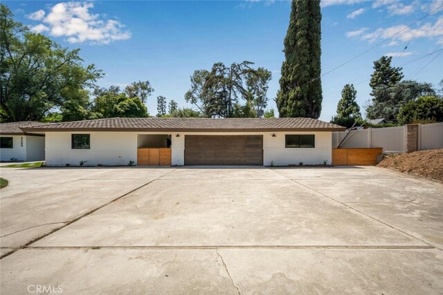 3209 Lakeknoll Dr, Fullerton, CA 92835 - view of front facade featuring concrete driveway and an attached garage