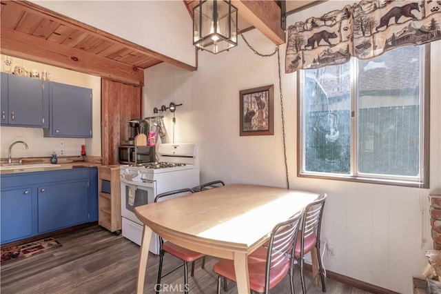 1100 Sugarloaf Blvd, Big Bear City, CA 92314 - dining area with dark wood-style floors and beam ceiling