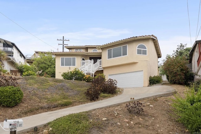 1295 Buenos Ave, San Diego, CA 92110 - view of front of house with a garage, stucco siding, and concrete driveway
