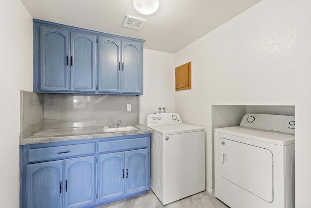 1295 Buenos Ave, San Diego, CA 92110 - laundry room featuring cabinet space and washing machine and clothes dryer