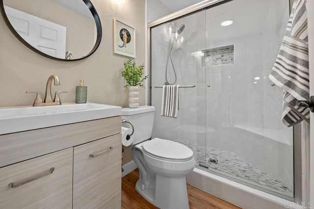 1810 Stanton Rd, Encinitas, CA 92024 - bathroom with a stall shower, vanity, wood finished floors, and a textured wall