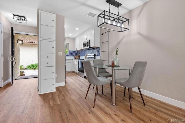 1810 Stanton Rd, Encinitas, CA 92024 - dining space with light wood-style floors, recessed lighting, and a chandelier