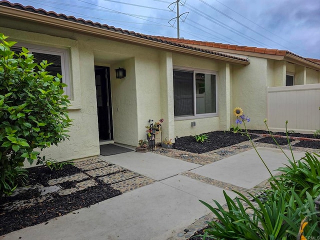 1810 Stanton Rd, Encinitas, CA 92024 - view of exterior entry featuring a patio and stucco siding