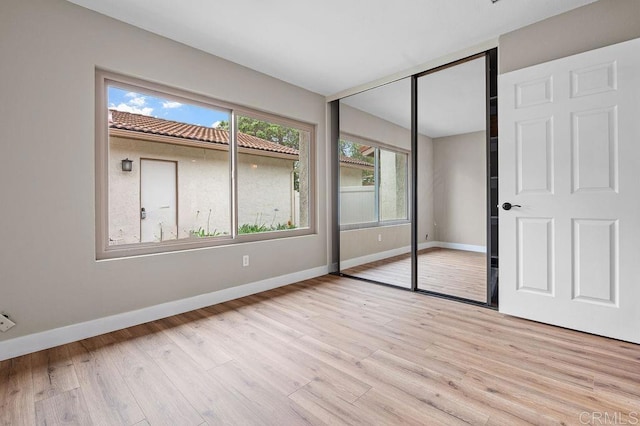 1810 Stanton Rd, Encinitas, CA 92024 - unfurnished bedroom with a closet and light wood-style flooring