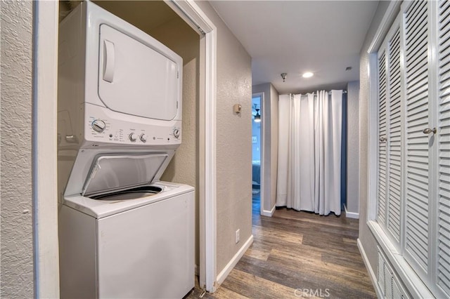 45 Stenner St Unit E, San Luis Obispo, CA 93405 - washroom featuring stacked washer / dryer, a textured wall, wood finished floors, baseboards, and recessed lighting