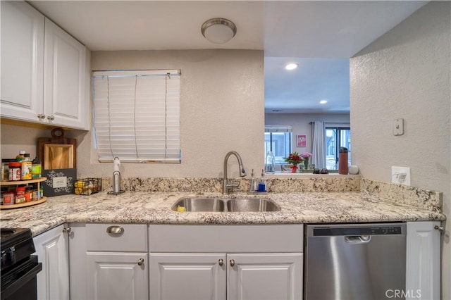45 Stenner St Unit E, San Luis Obispo, CA 93405 - kitchen with dishwasher, a sink, a textured wall, white cabinetry, and black gas stove