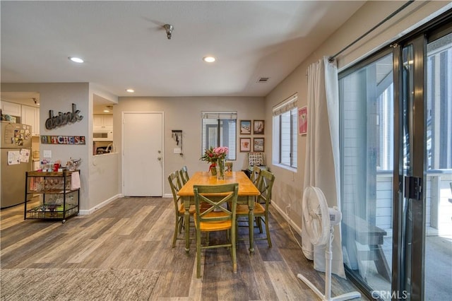 45 Stenner St Unit E, San Luis Obispo, CA 93405 - dining room featuring baseboards, wood finished floors, and recessed lighting