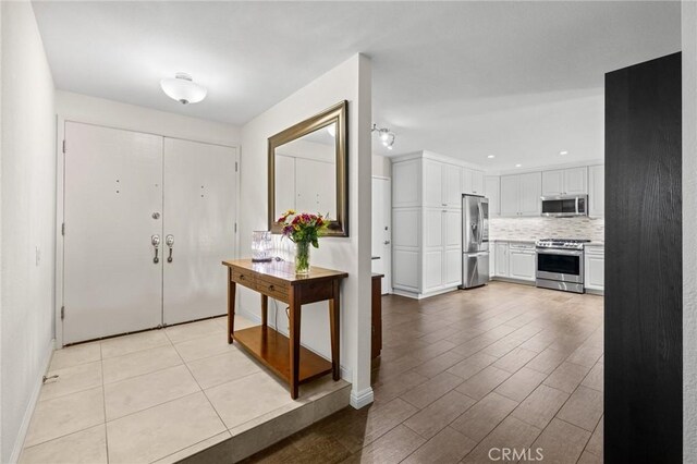 23291 Via Gaudix, Mission Viejo, CA 92691 - entryway featuring light wood finished floors