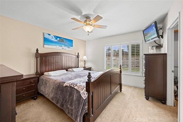 23291 Via Gaudix, Mission Viejo, CA 92691 - bedroom with light carpet, a ceiling fan, and baseboards