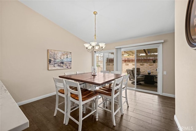 23291 Via Gaudix, Mission Viejo, CA 92691 - dining space with a chandelier, dark wood-style floors, baseboards, and vaulted ceiling