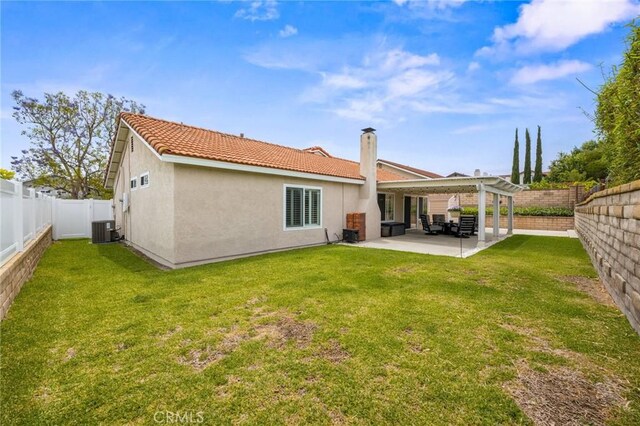 23291 Via Gaudix, Mission Viejo, CA 92691 - back of property with central air condition unit, stucco siding, a patio area, and a tile roof