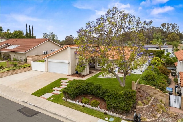 23291 Via Gaudix, Mission Viejo, CA 92691 - view of front facade featuring concrete driveway, an attached garage, and stucco siding