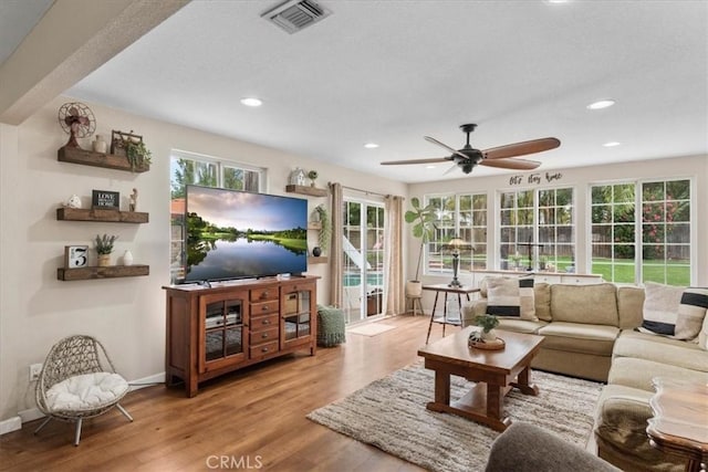 11029 Bel Air Ave, Ontario, CA 91762 - living area with wood finished floors, ceiling fan, and recessed lighting