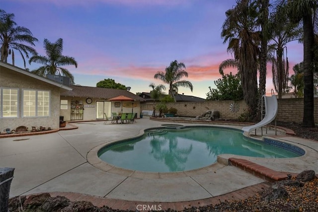 11029 Bel Air Ave, Ontario, CA 91762 - view of swimming pool with a patio area, a fenced backyard, and a water slide
