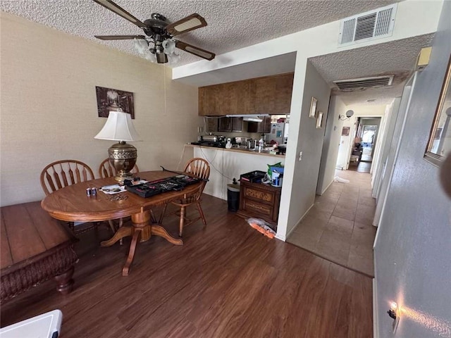 610 S Santa Fe St Unit 2, Hemet, CA 92543 - dining area with a ceiling fan, wood finished floors, and a textured ceiling