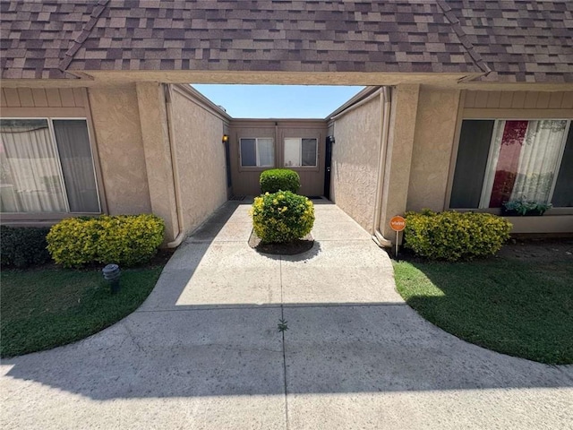 610 S Santa Fe St Unit 2, Hemet, CA 92543 - view of home's exterior with stucco siding, a shingled roof, and a patio