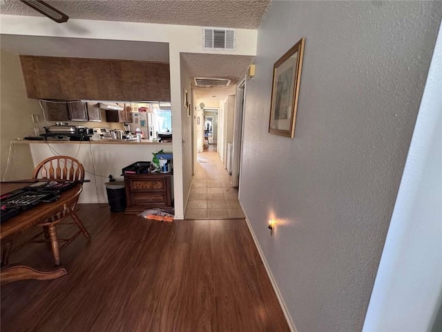 610 S Santa Fe St Unit 2, Hemet, CA 92543 - hall featuring wood finished floors, baseboards, a textured wall, and a textured ceiling