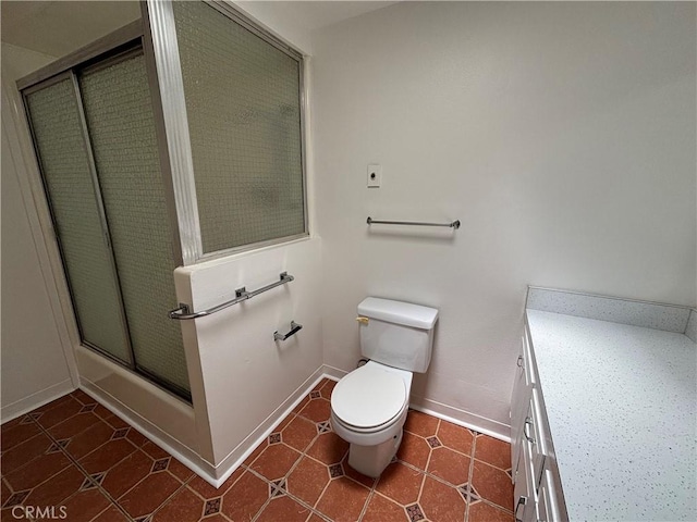 13800M1-39K Annandale Dr, Seal Beach, CA 90720 - bathroom with toilet, a shower with shower door, baseboards, and vanity