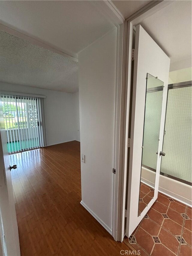 13800M1-39K Annandale Dr, Seal Beach, CA 90720 - corridor featuring a textured ceiling and wood finished floors
