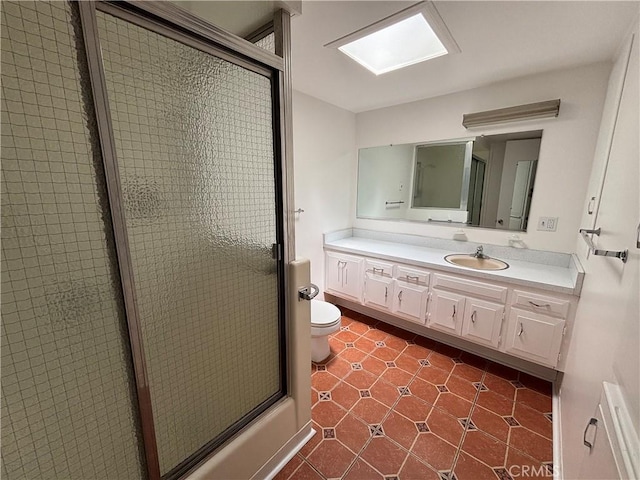 13800M1-39K Annandale Dr, Seal Beach, CA 90720 - bathroom with an enclosed shower, vanity, toilet, tile patterned flooring, and a skylight