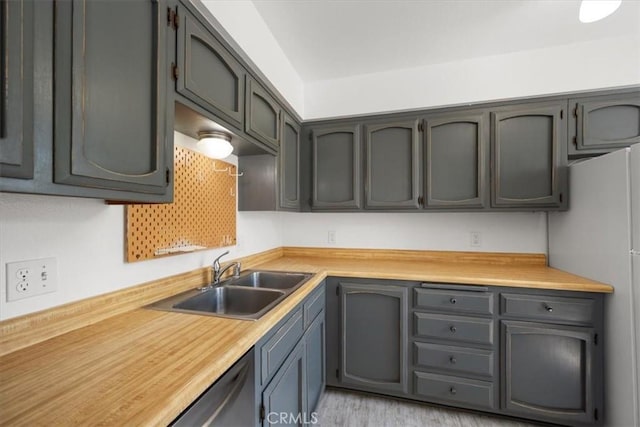 676 N 12th St Unit 3, Grover Beach, CA 93433 - kitchen with a sink, freestanding refrigerator, light countertops, and light wood finished floors