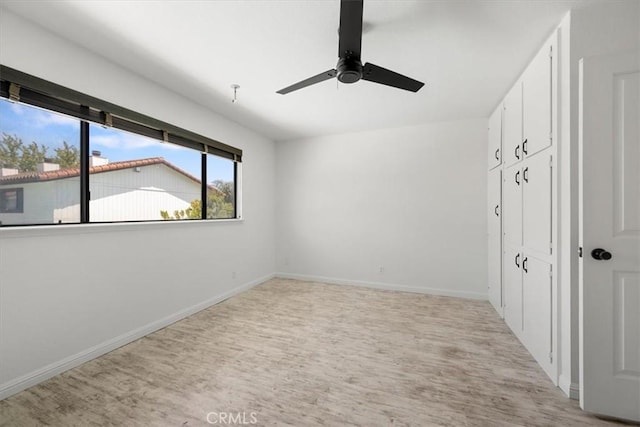 676 N 12th St Unit 3, Grover Beach, CA 93433 - unfurnished bedroom featuring light wood finished floors, baseboards, ceiling fan, and a closet