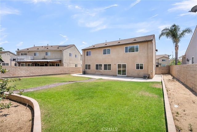 11868 Amethyst Ct, Jurupa Valley, CA 91752 - back of property with stucco siding and a patio area