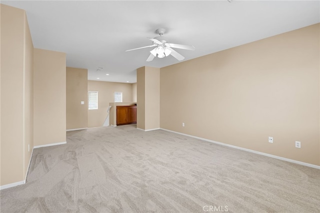 11868 Amethyst Ct, Jurupa Valley, CA 91752 - unfurnished living room featuring light colored carpet, ceiling fan, baseboards, and recessed lighting