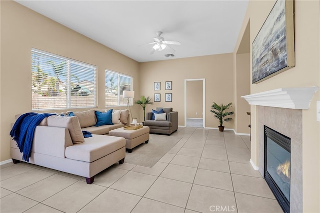 11868 Amethyst Ct, Jurupa Valley, CA 91752 - living room with ceiling fan, light tile patterned flooring, a fireplace, and baseboards