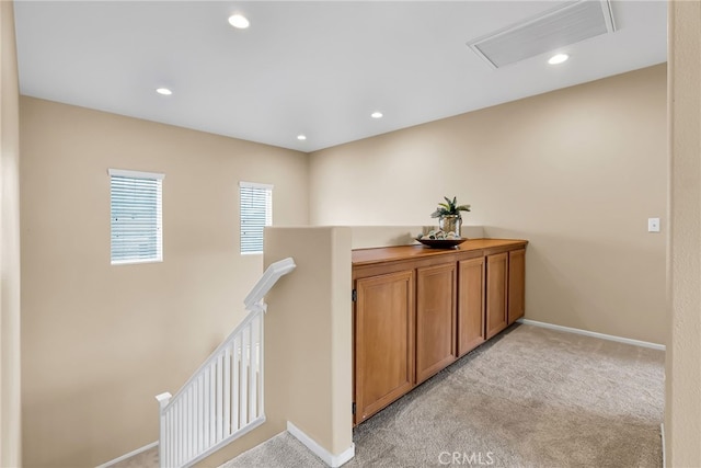 11868 Amethyst Ct, Jurupa Valley, CA 91752 - hallway featuring an upstairs landing, light carpet, recessed lighting, baseboards, and attic access