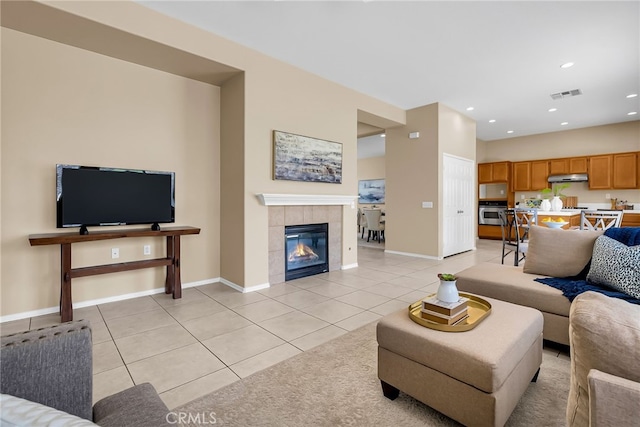 11868 Amethyst Ct, Jurupa Valley, CA 91752 - living area featuring light tile patterned floors, baseboards, recessed lighting, and a tile fireplace