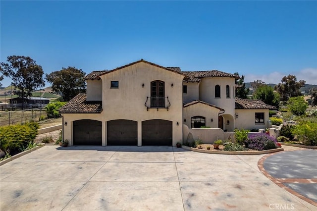 4950 Davenport Creek Rd, San Luis Obispo, CA 93401 - mediterranean / spanish-style home with a balcony, an attached garage, driveway, and a tile roof