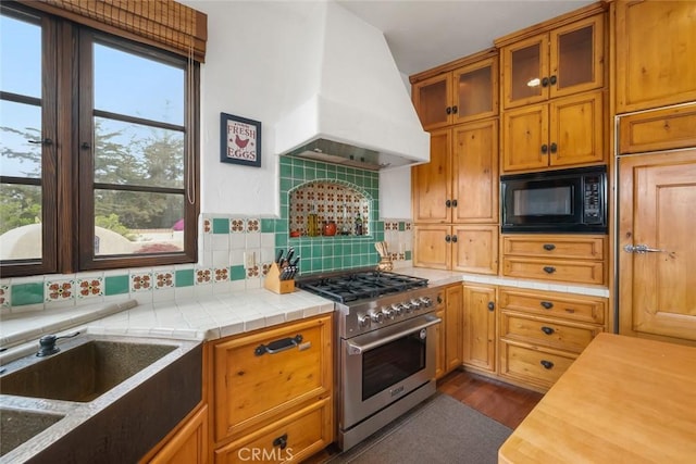 4950 Davenport Creek Rd, San Luis Obispo, CA 93401 - kitchen with luxury range, premium range hood, black microwave, tasteful backsplash, and dark wood-type flooring