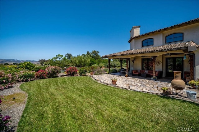 4950 Davenport Creek Rd, San Luis Obispo, CA 93401 - view of grassy yard with an outdoor hangout area, a patio, a ceiling fan, and french doors