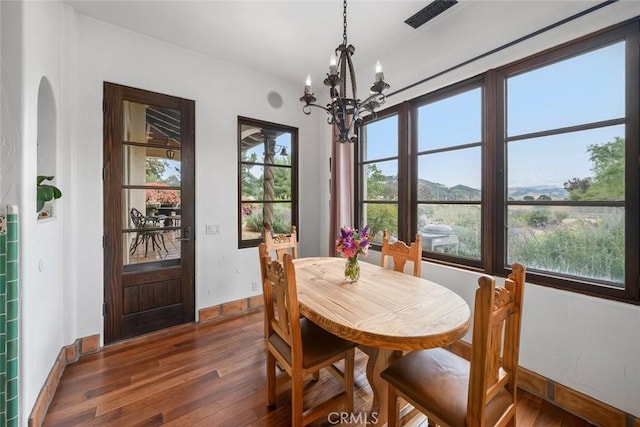 4950 Davenport Creek Rd, San Luis Obispo, CA 93401 - dining space with dark wood-style floors and a chandelier