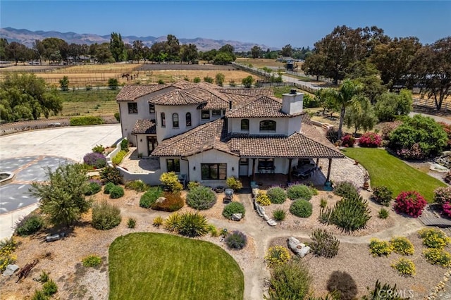4950 Davenport Creek Rd, San Luis Obispo, CA 93401 - view of front of house with stucco siding, a view of rural / pastoral area, a tile roof, and a mountain view