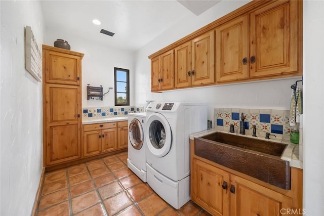 4950 Davenport Creek Rd, San Luis Obispo, CA 93401 - washroom with washer and dryer, cabinet space, and light tile patterned floors