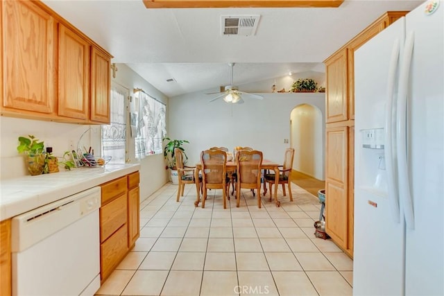 21919 Standing Rock Ave, Apple Valley, CA 92307 - dining area featuring arched walkways, a ceiling fan, light tile patterned floors, and vaulted ceiling