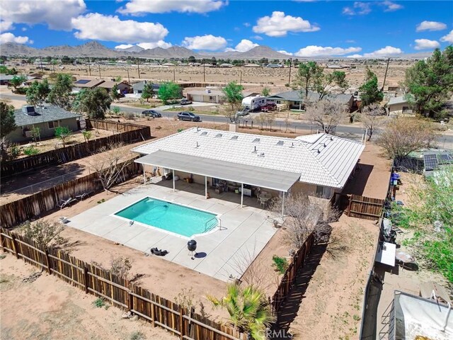 21919 Standing Rock Ave, Apple Valley, CA 92307 - view of swimming pool with a fenced backyard, a mountain view, and a patio area