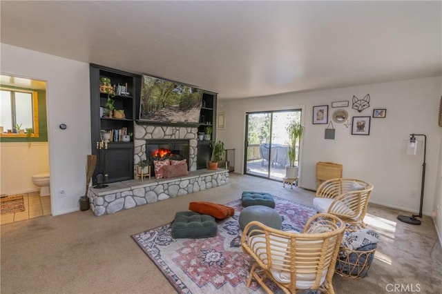 33310 Conway Dr, Running Springs, CA 92308 - living area with a fireplace, carpet flooring, and baseboards