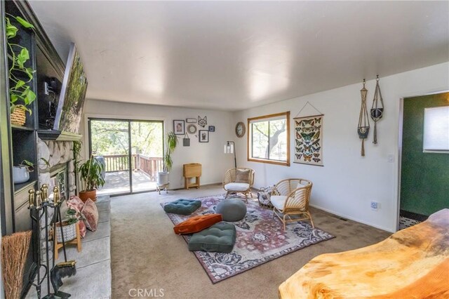 33310 Conway Dr, Running Springs, CA 92308 - carpeted living room featuring a fireplace